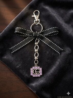 Silver Tone with Purple Crystal GG Charm Keychain with Black Bow